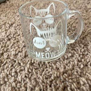 Gently used clear cat mug with handle. Primted same in both sidea